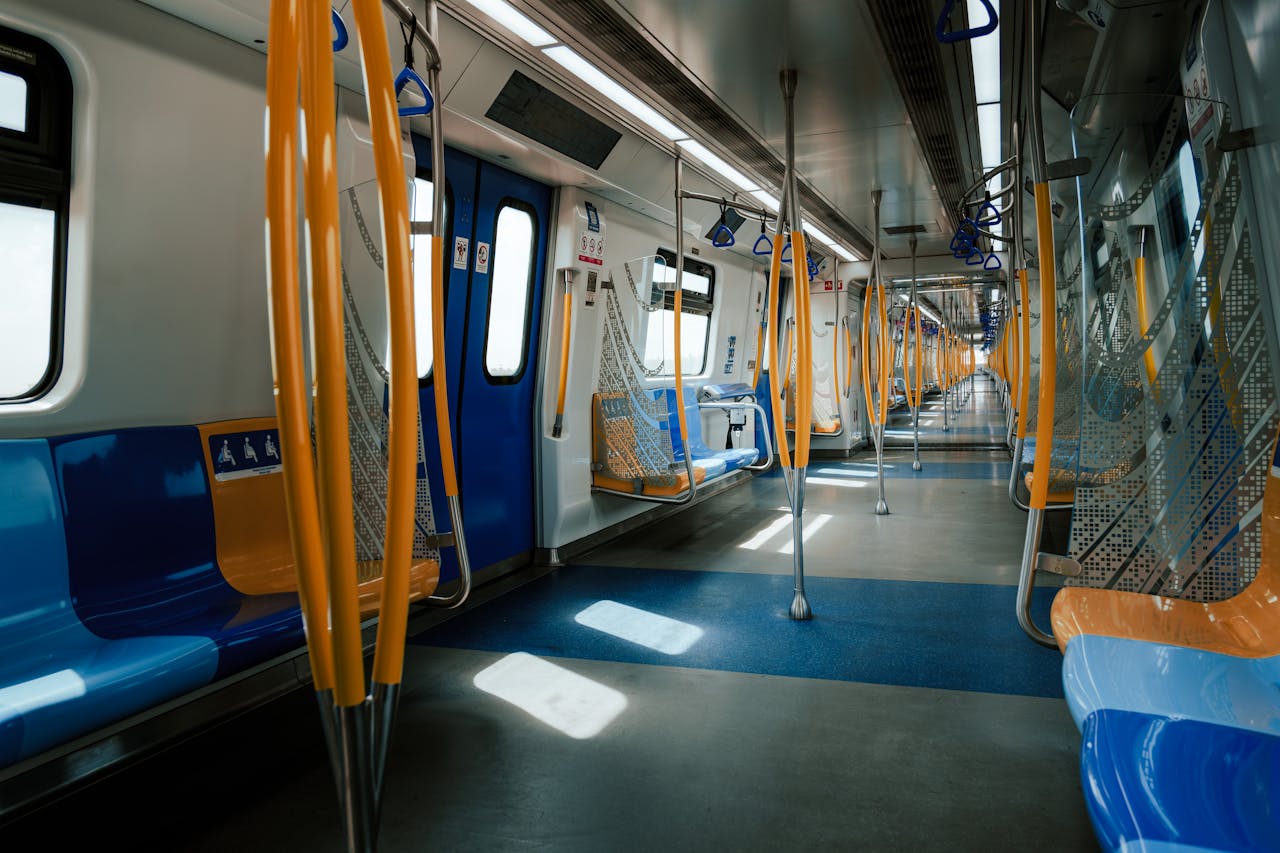 An empty MRT train interior showcasing modern public transport in Kuala Lumpur, Malaysia.